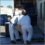 Thumbnail image of a person in a full-body white PPE